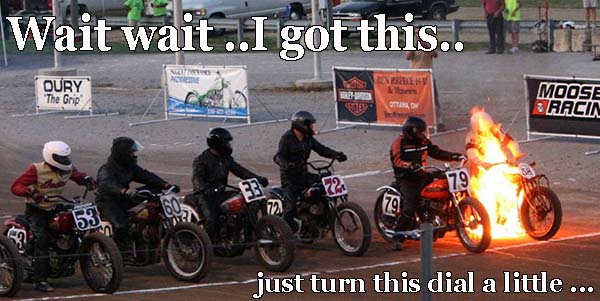 motorcycle on fire at a race the guy says wiat wait I got this just turen this dial 